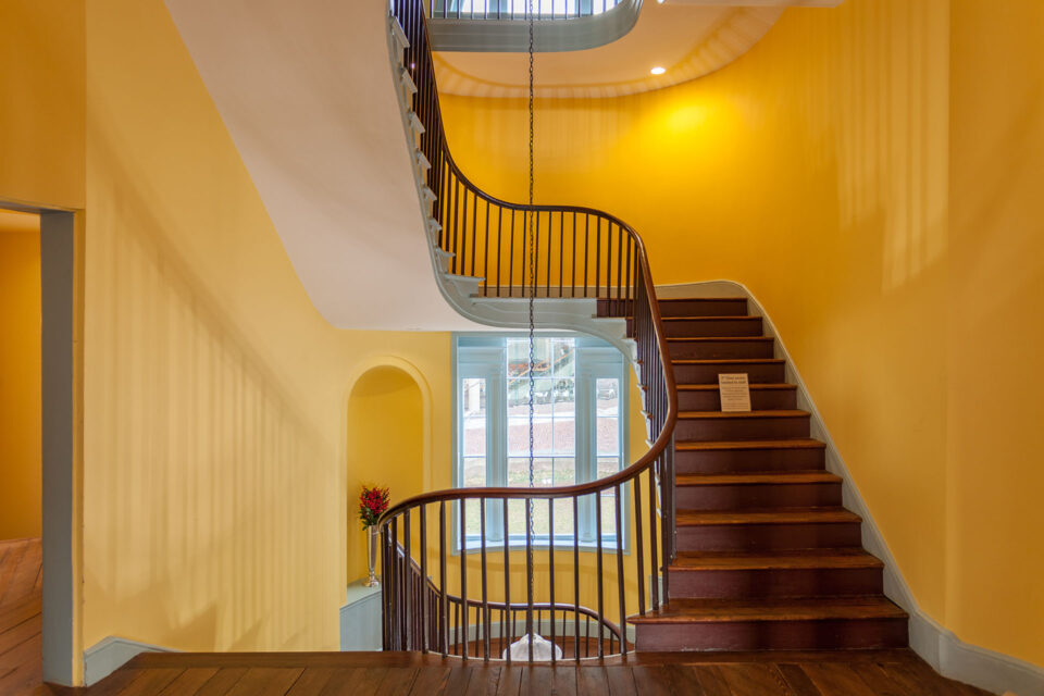 The two stairs separating the social structure at The Octagon: the grand main stair and ‘hidden’ service stairs to the left.